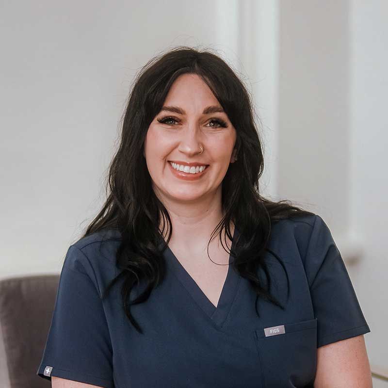 Andrea Sleeth, WHNP wearing blue scrubs