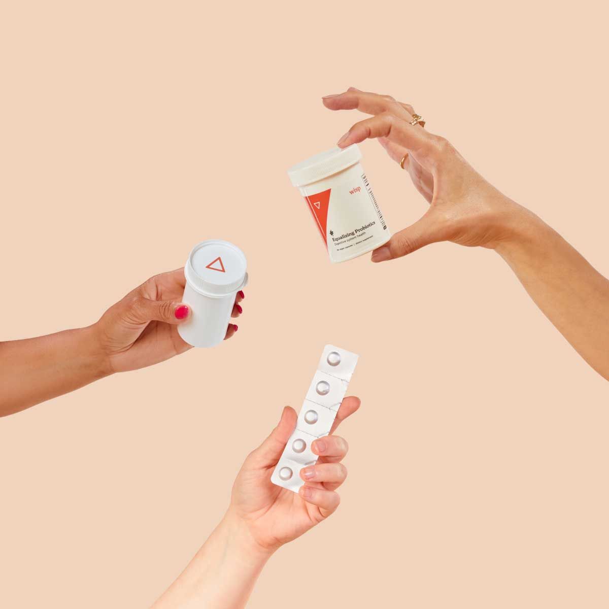 Various Wisp products in people's hands with a cream background
