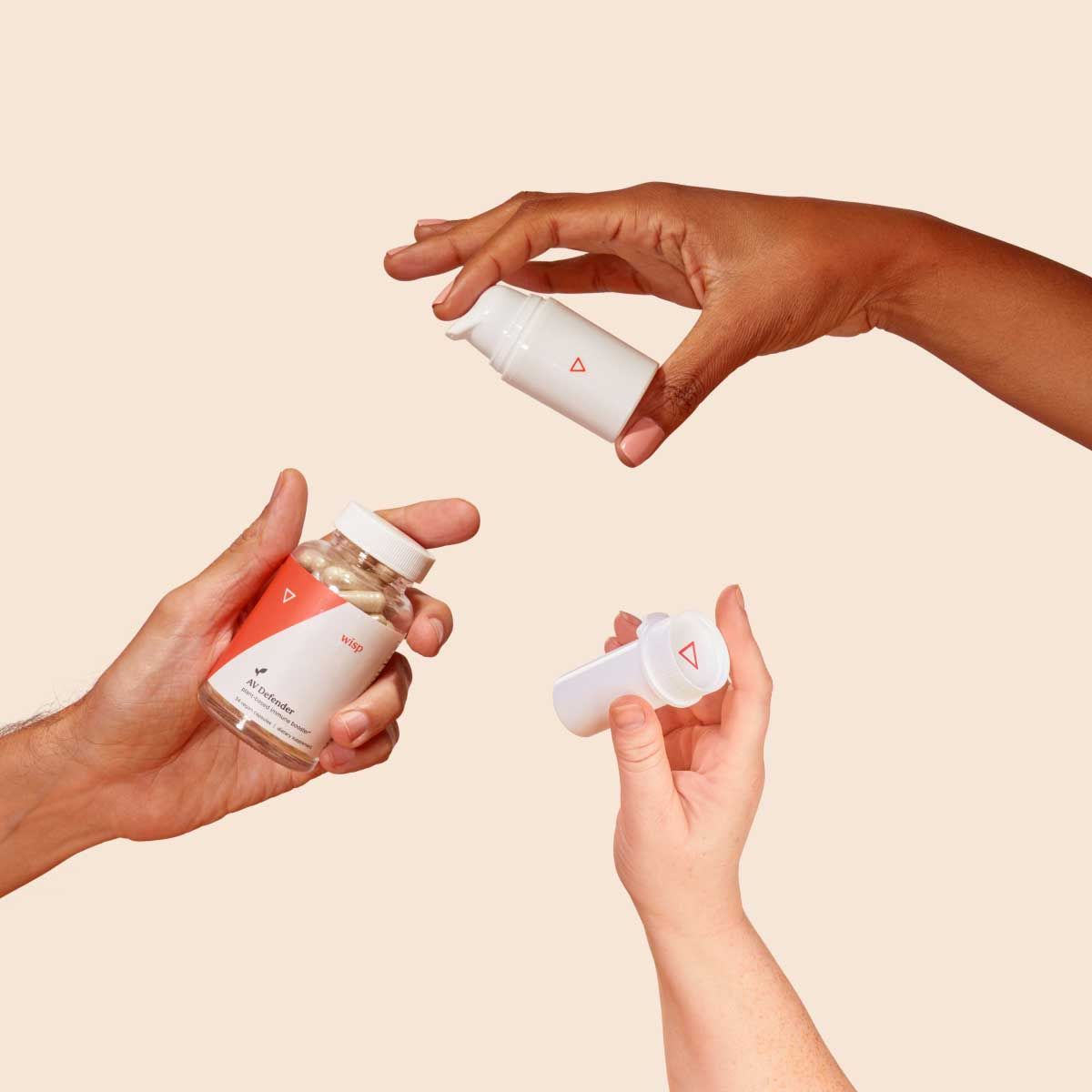 Various Wisp products in people's hands with a cream background
