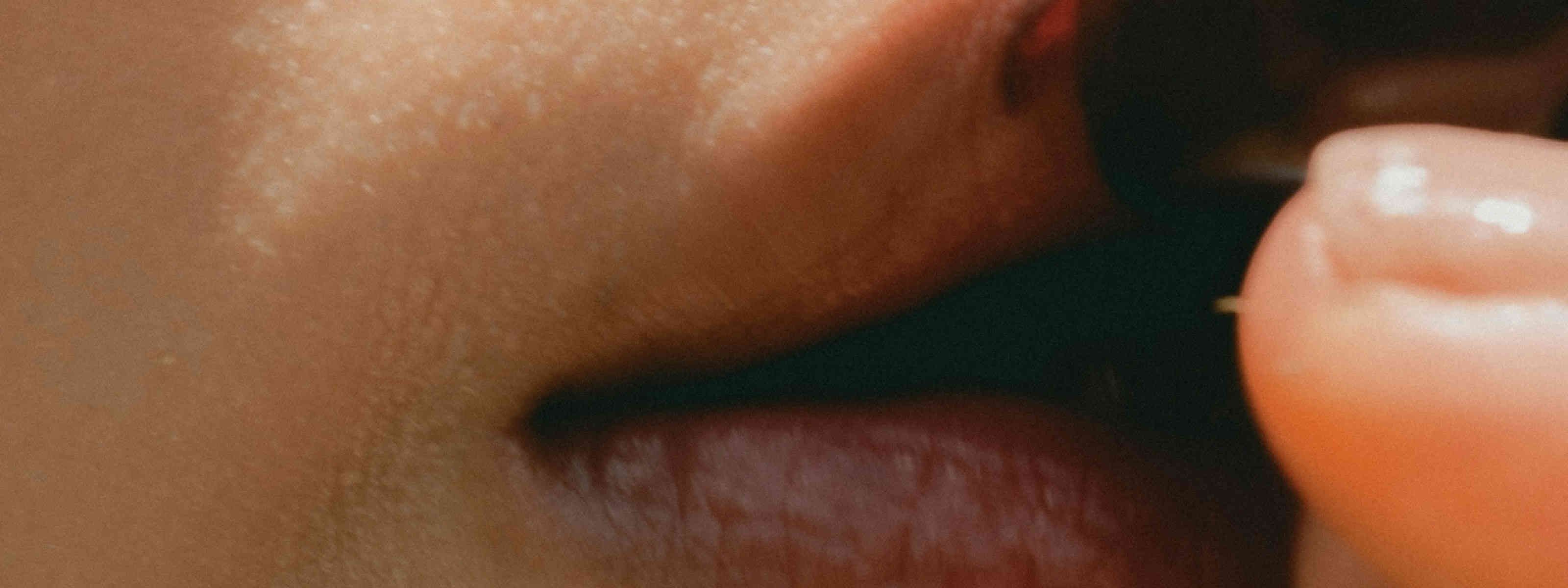 image of woman's lips on a cherry