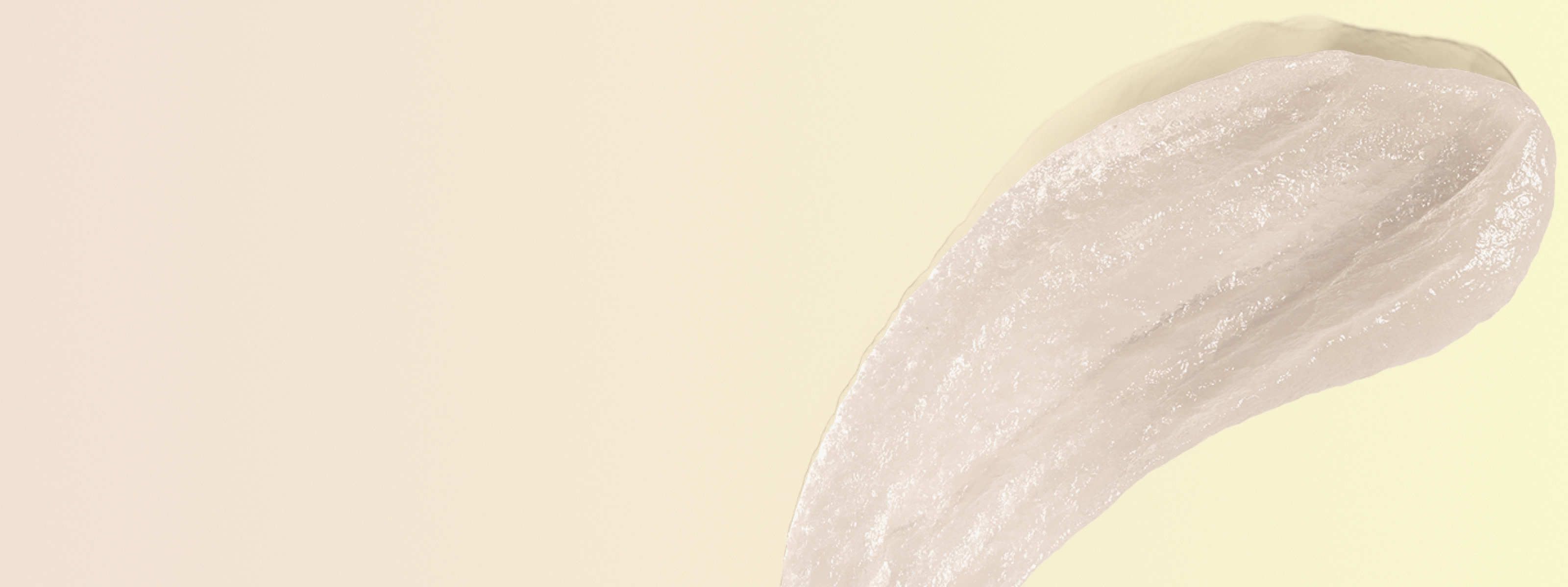 swipe of white acyclovir cream in front of a light green and beige background