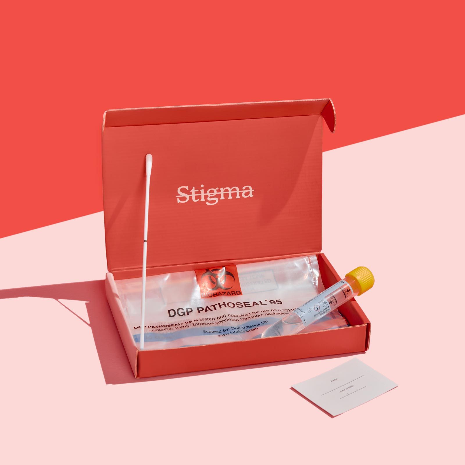 A Wisp diagnostics box with sample collection supplies on a pink surface with a red background