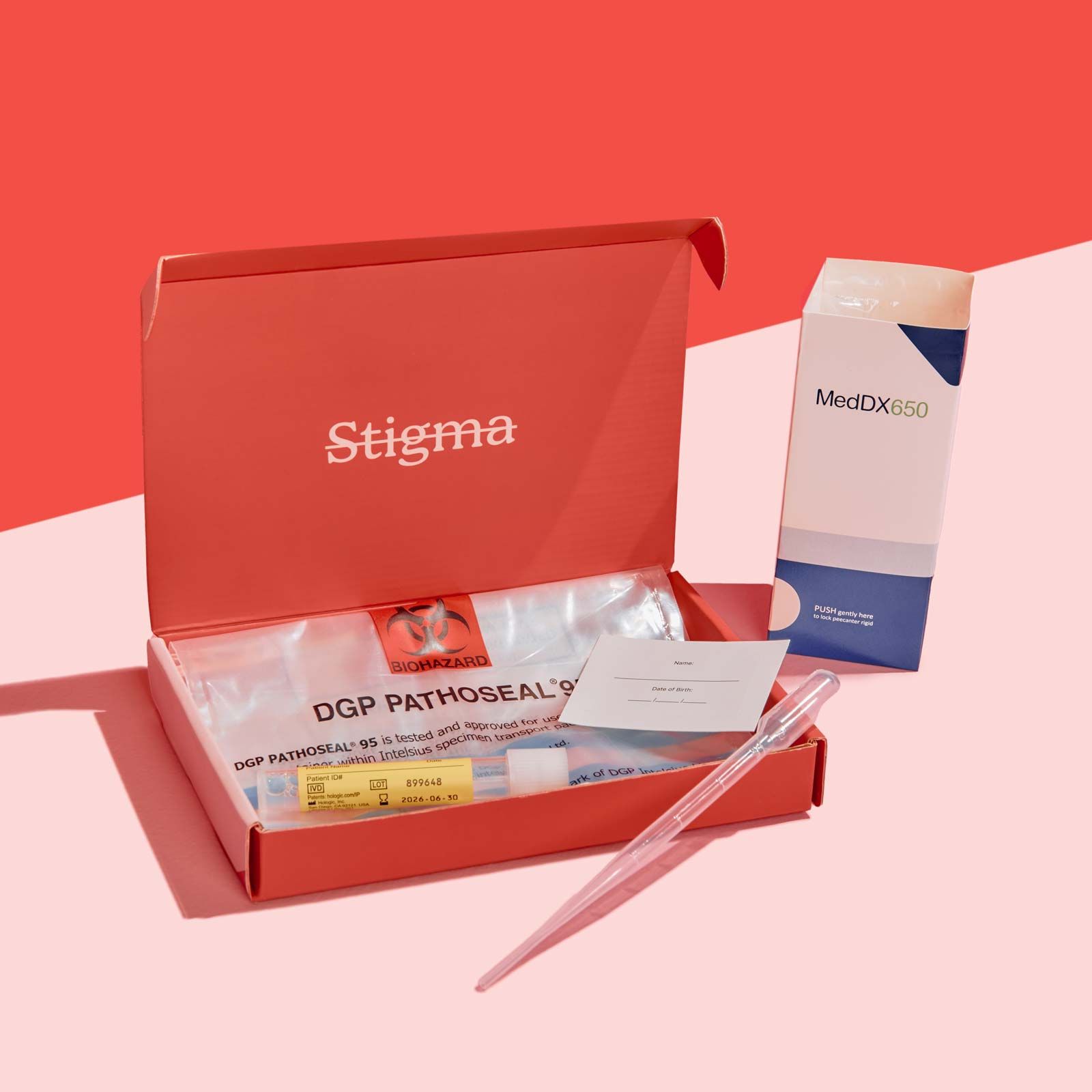A Wisp diagnostics box with sample collection supplies on a pink surface with a red background