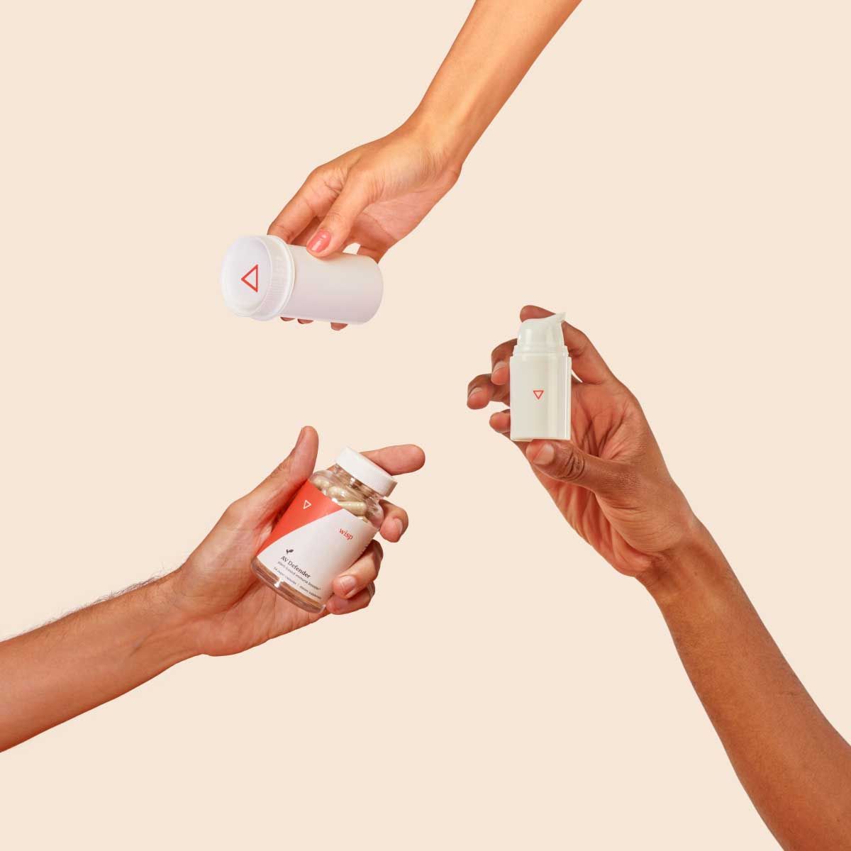 Various Wisp products in people's hands with a cream background