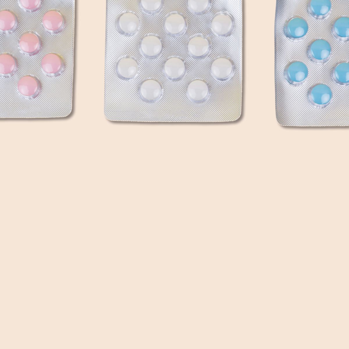 Packet of birth control pills on a cream background