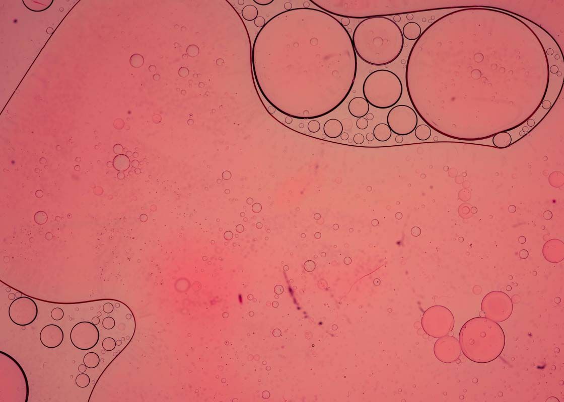 An abstract scientific liquid with a red hue