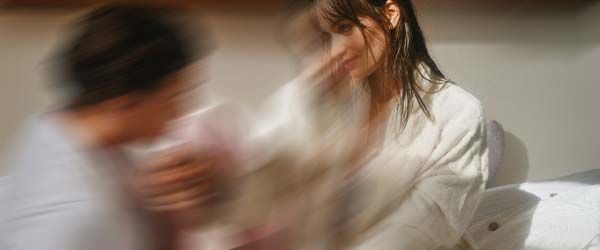 A woman looking provocatively at a man with motion blur
