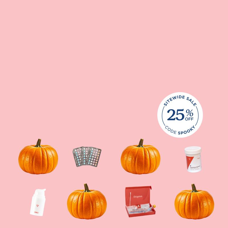 Pumpkins and various Wisp products with a pink background