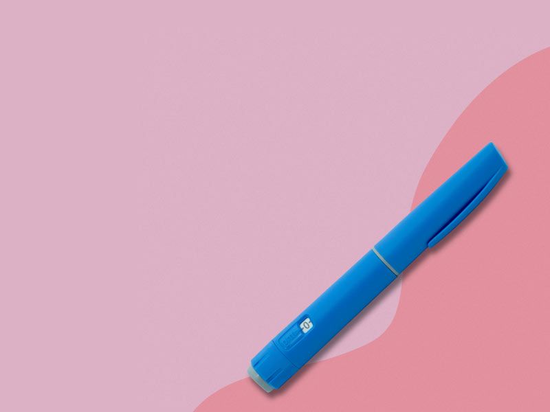 A Semaglutide pen on a two-toned pink background