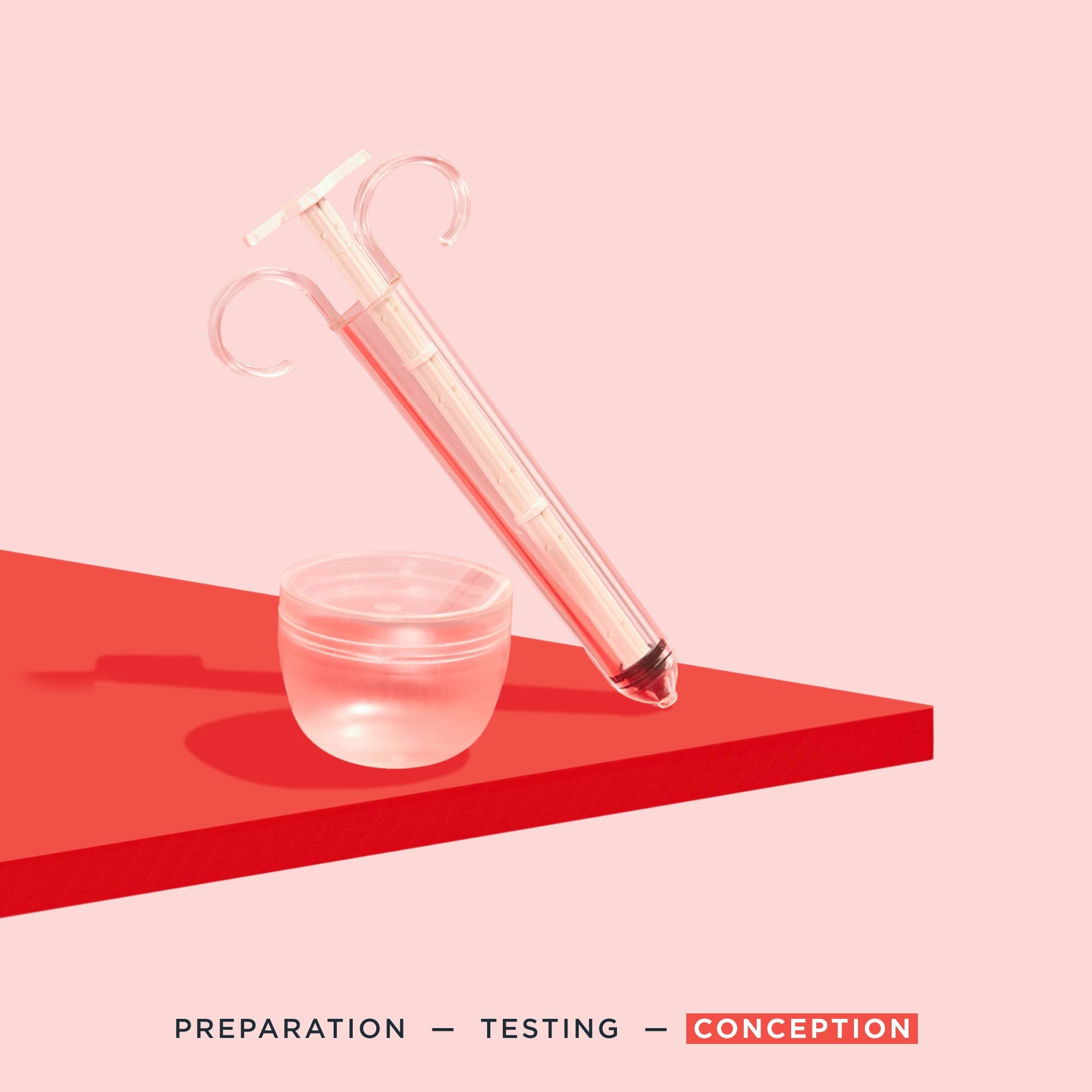Pherdal collection cup and syringe on a red surface with a pink background