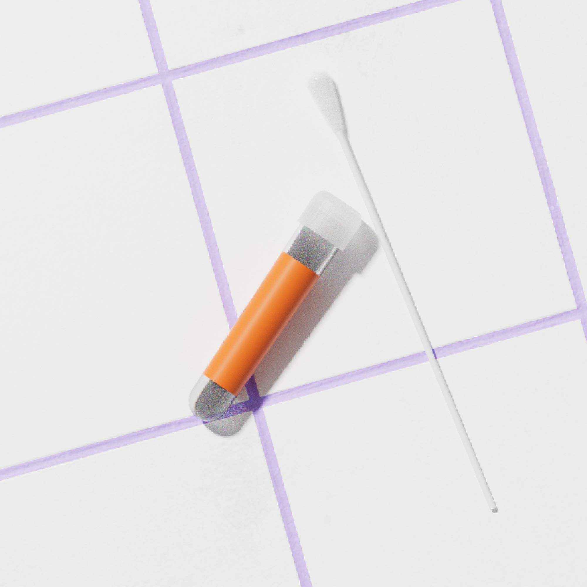 A testing swab and tube on a white and purple tile surface