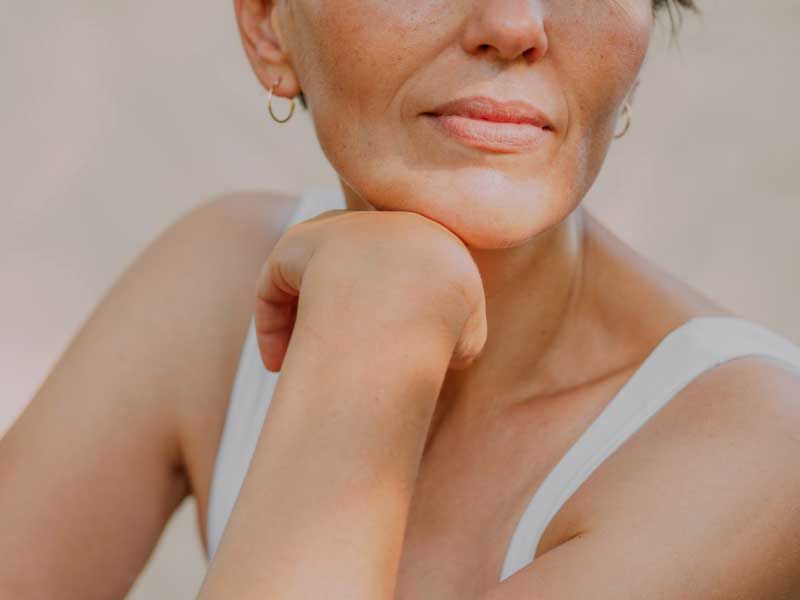 lower half of women's face against a gray background