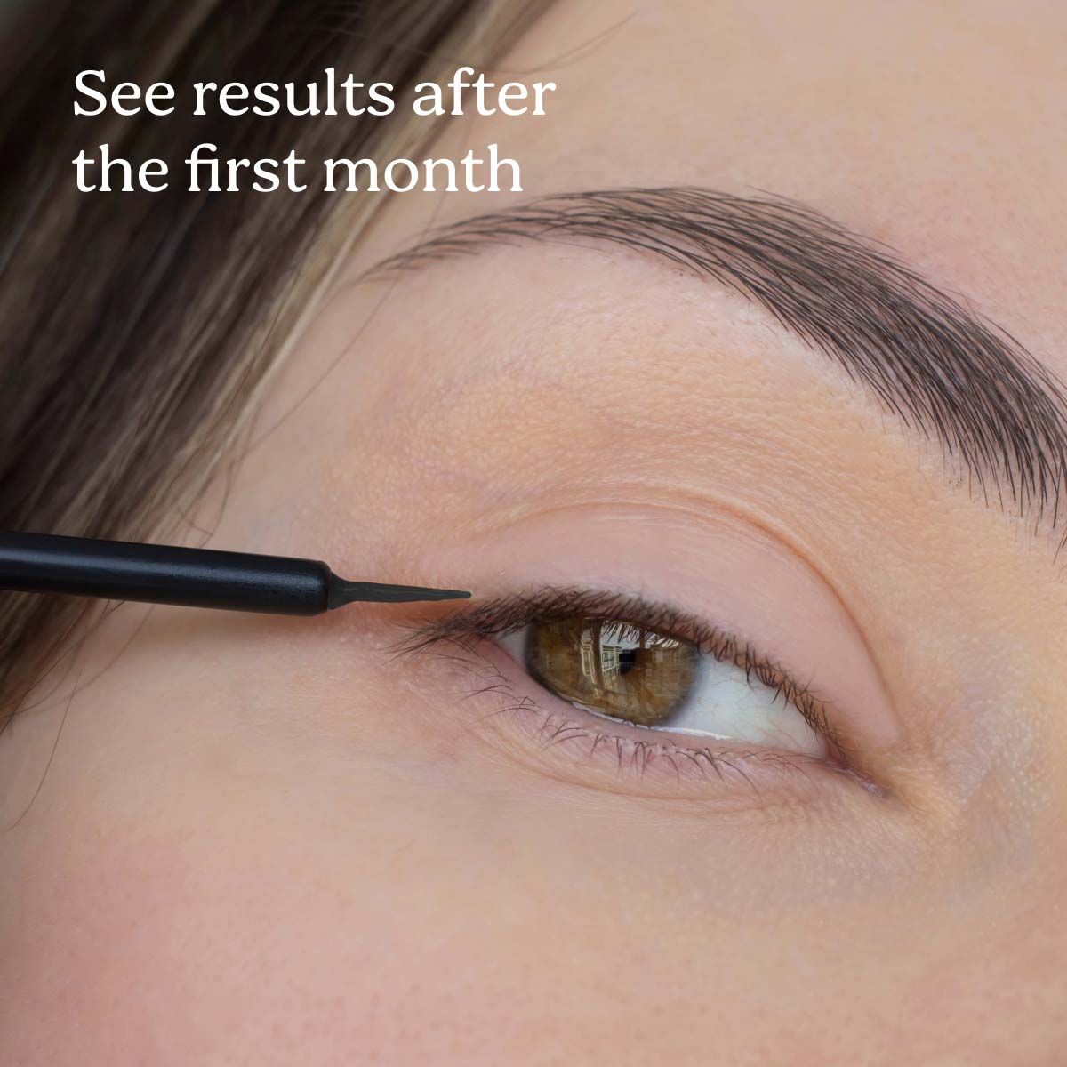 A close up image of a woman applying Bimatoprost to her eyelid