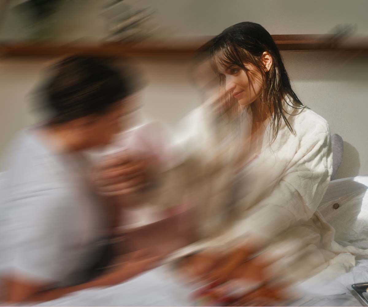 A woman and a man looking at each other intimately with motion blur