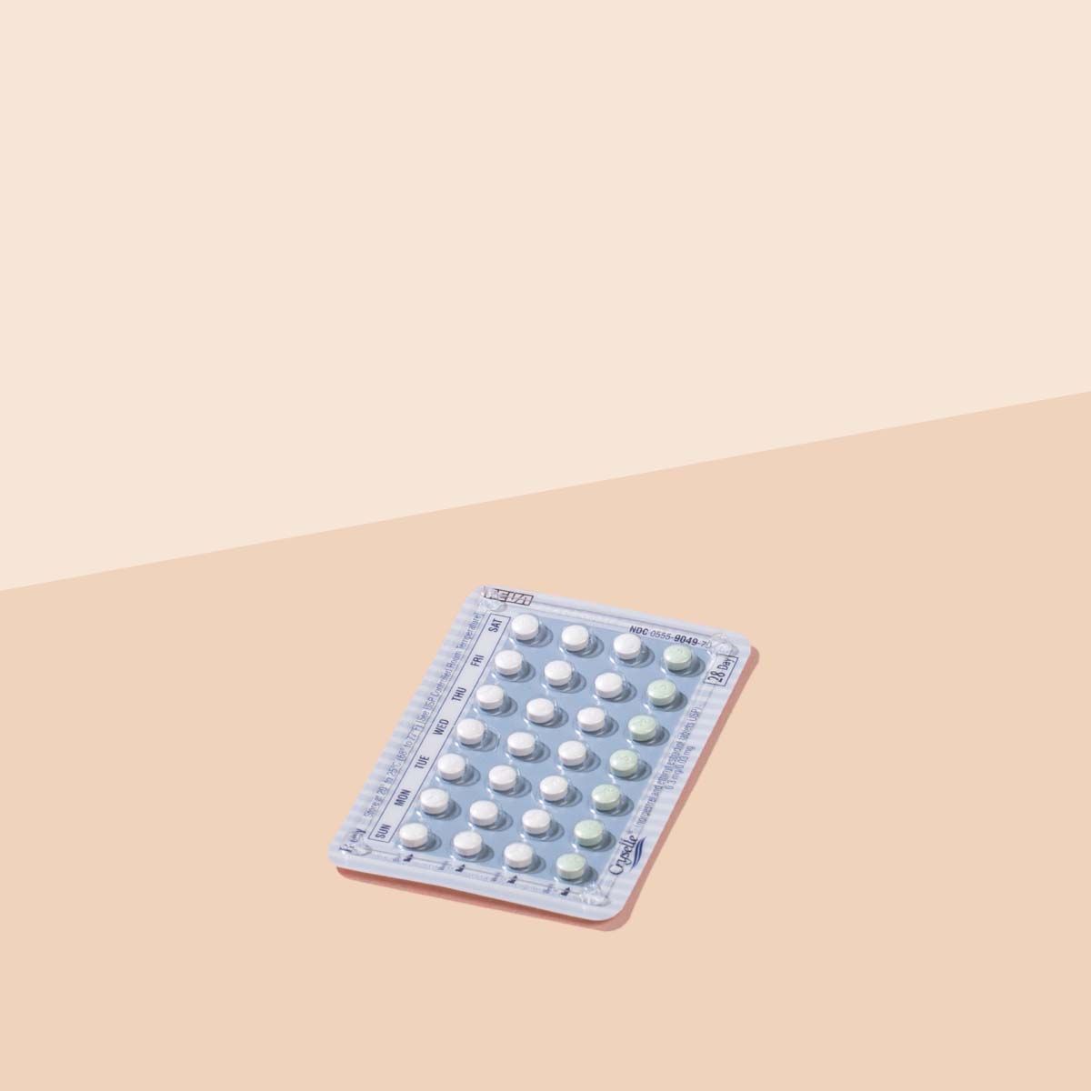 Packet of Lutera birth control pills on a cream background