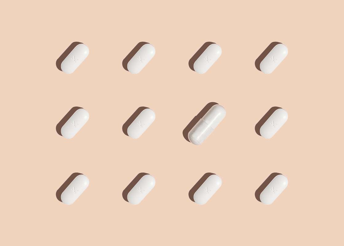 pills from Wisp to treat BV and Yeast Infections on a cream background