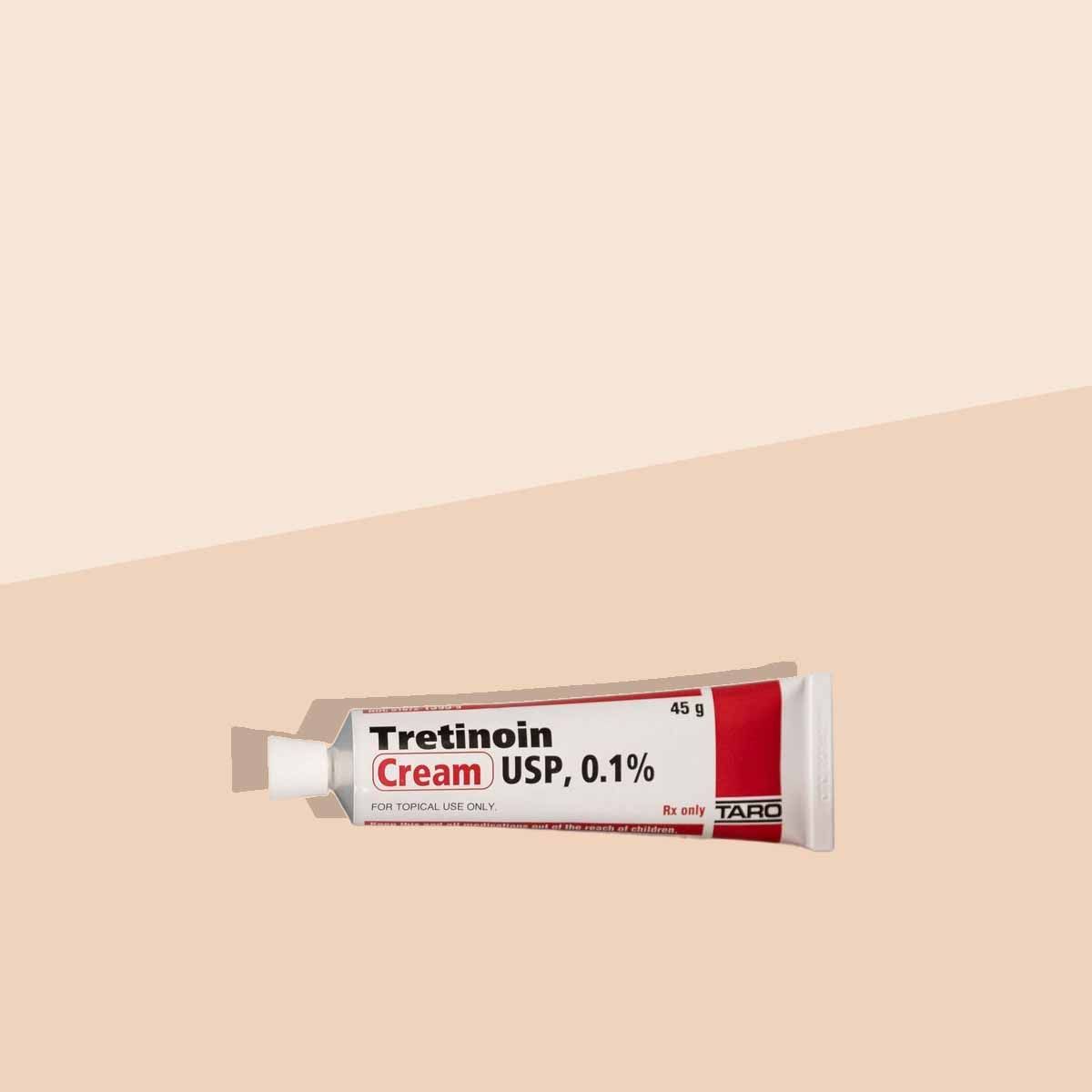 A tube of Tretinoin on a cream surface