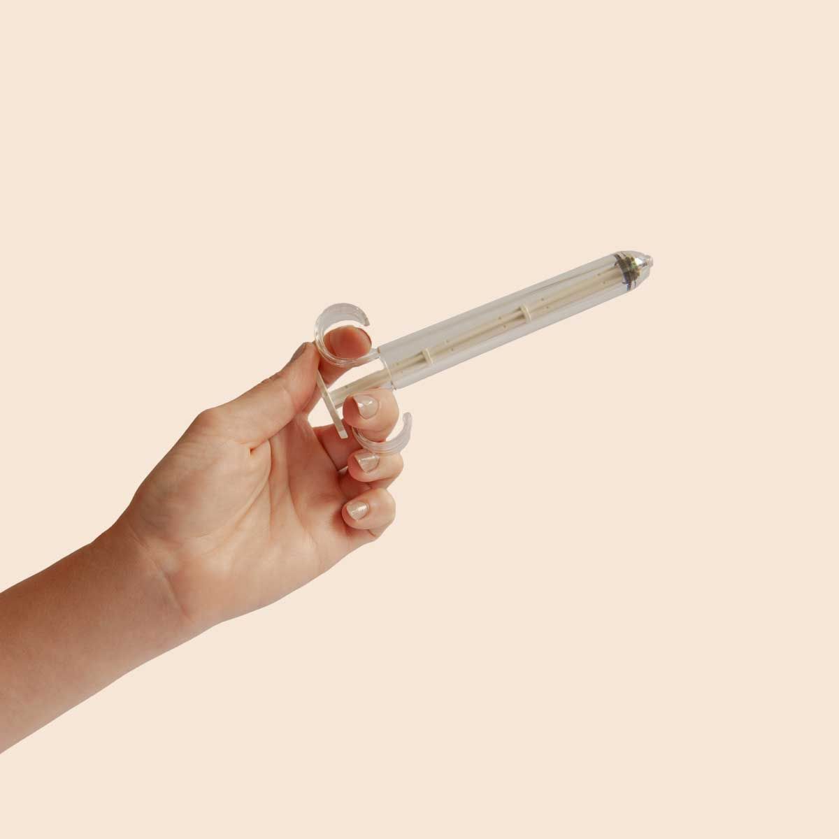 Pherdal collection syringe with a cream background
