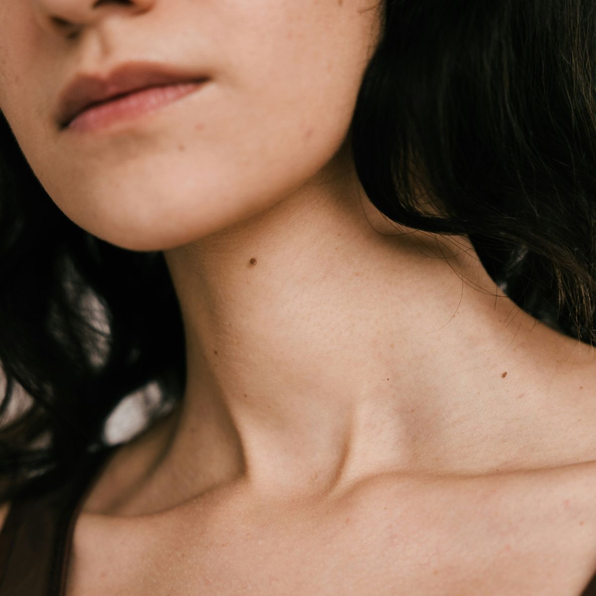 A close up of a woman with a neutral expression