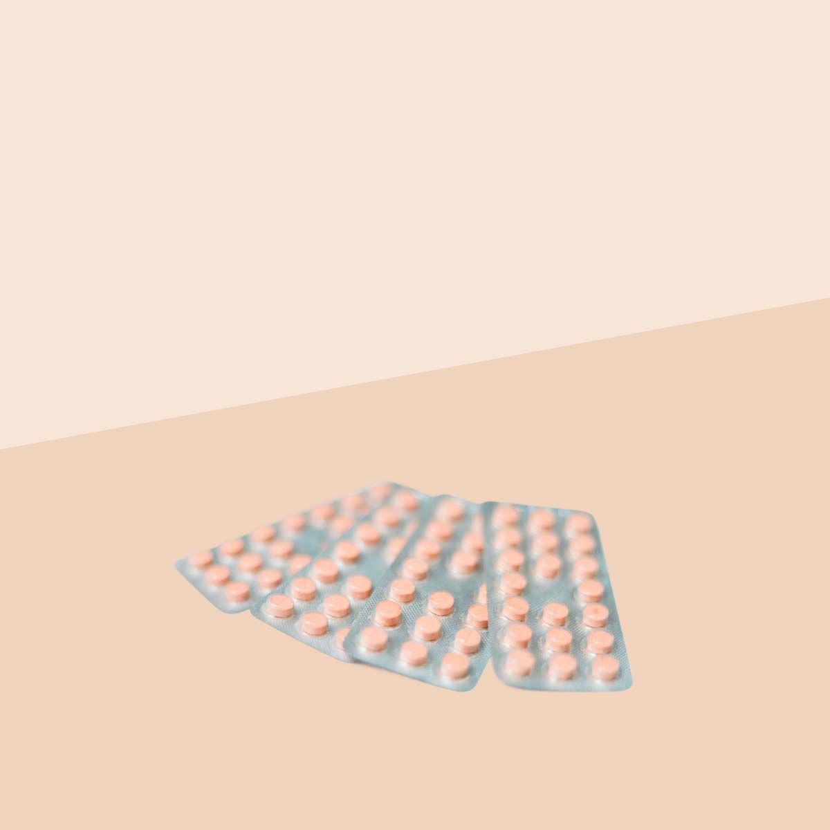 3 packets of Seasonique birth control pills on a cream surface