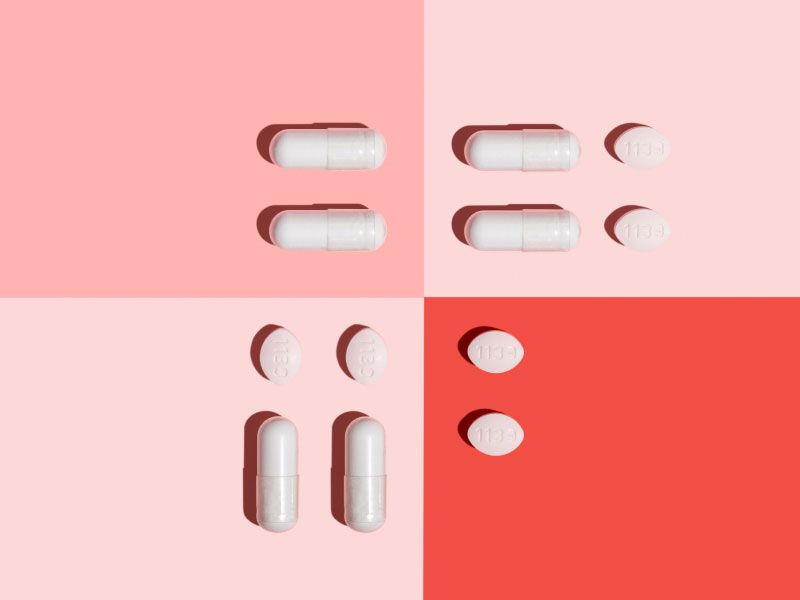 Yeast Infection treatment pills on a multicolored pink and red background
