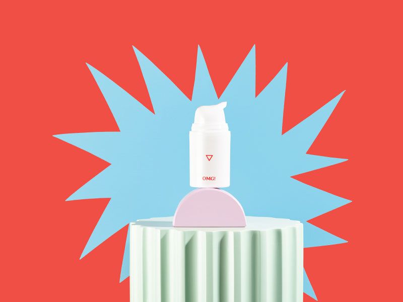 OMG! Cream on colorful abstract shapes with a light blue starburst behind it and a red background